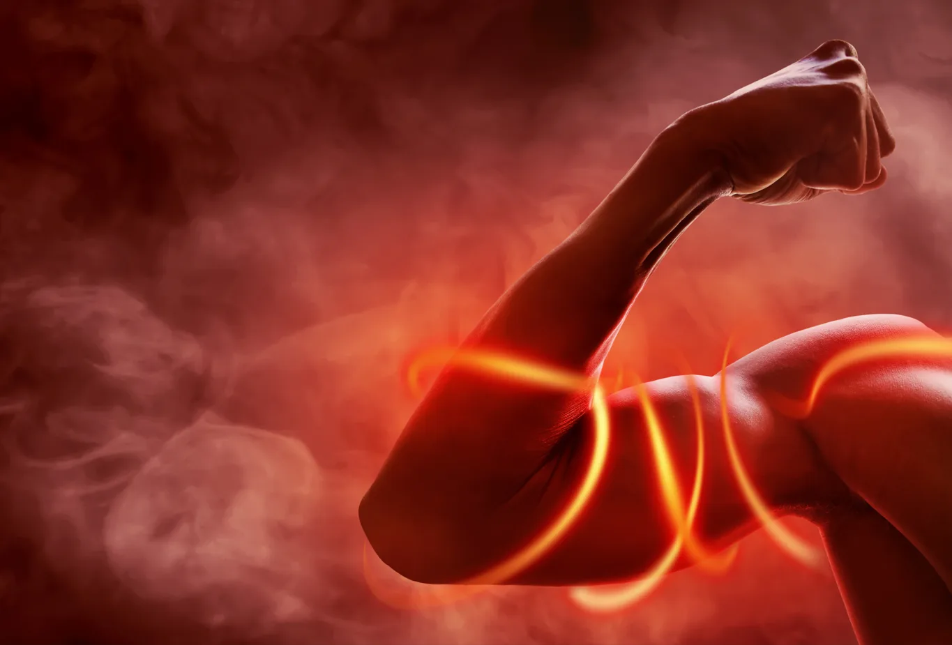 Muscular arm under load with red energy trails