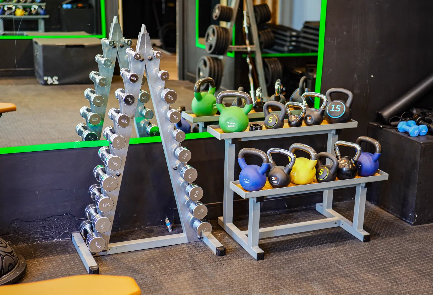 Kettlebells and chrome dumbbell rack in the functional area