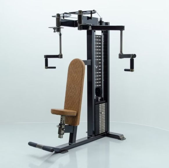 Pec deck machine with tan leather upholstery